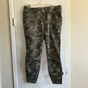 Camo skinny stretch Jean. Faded. Silver embellishment at ankle. Size 14